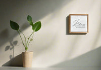 Framed artwork with text on a white background