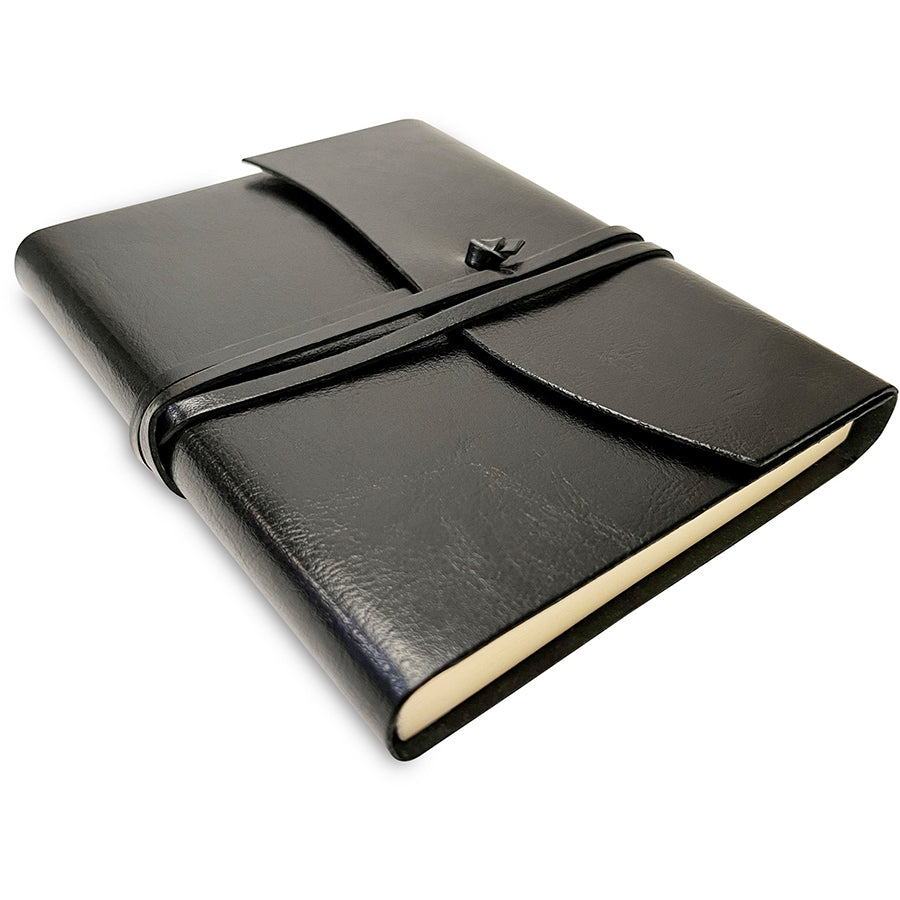 Black leather notebook with a strap closure on a white background