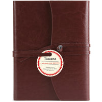 Dark red leather journal with a label on a white background