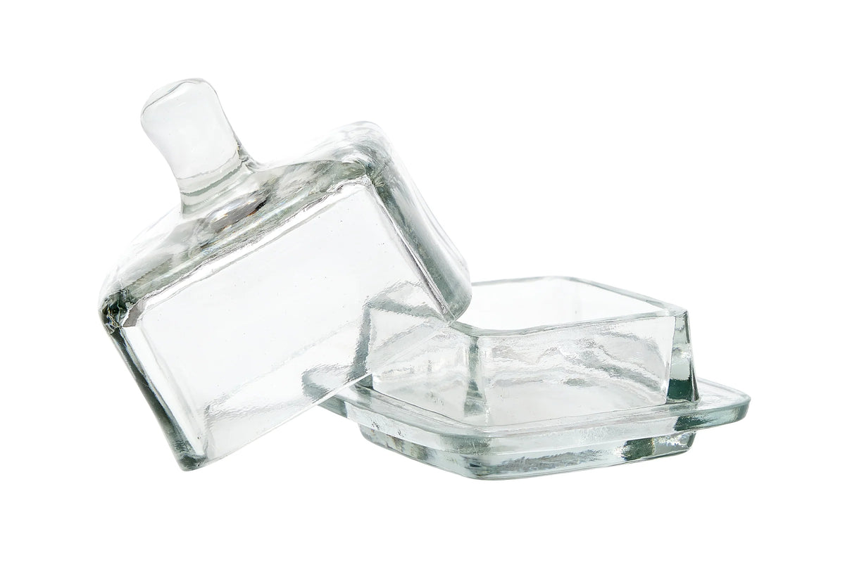Clear square glass jam jar with lid on a white background