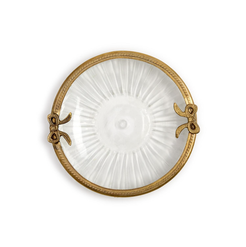 Decorative glass trinket tray with a gold rim on a white background