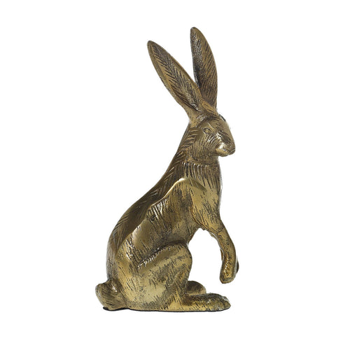 Bronze hare figurine on a white background