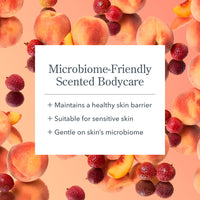 Product advertisement for microbiome-friendly scented bodycare with peaches and raspberries on a peach background.