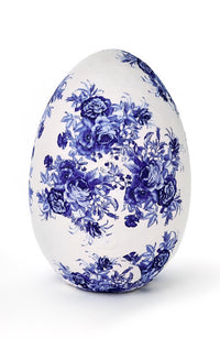 Decorative egg with blue floral pattern on a white background
