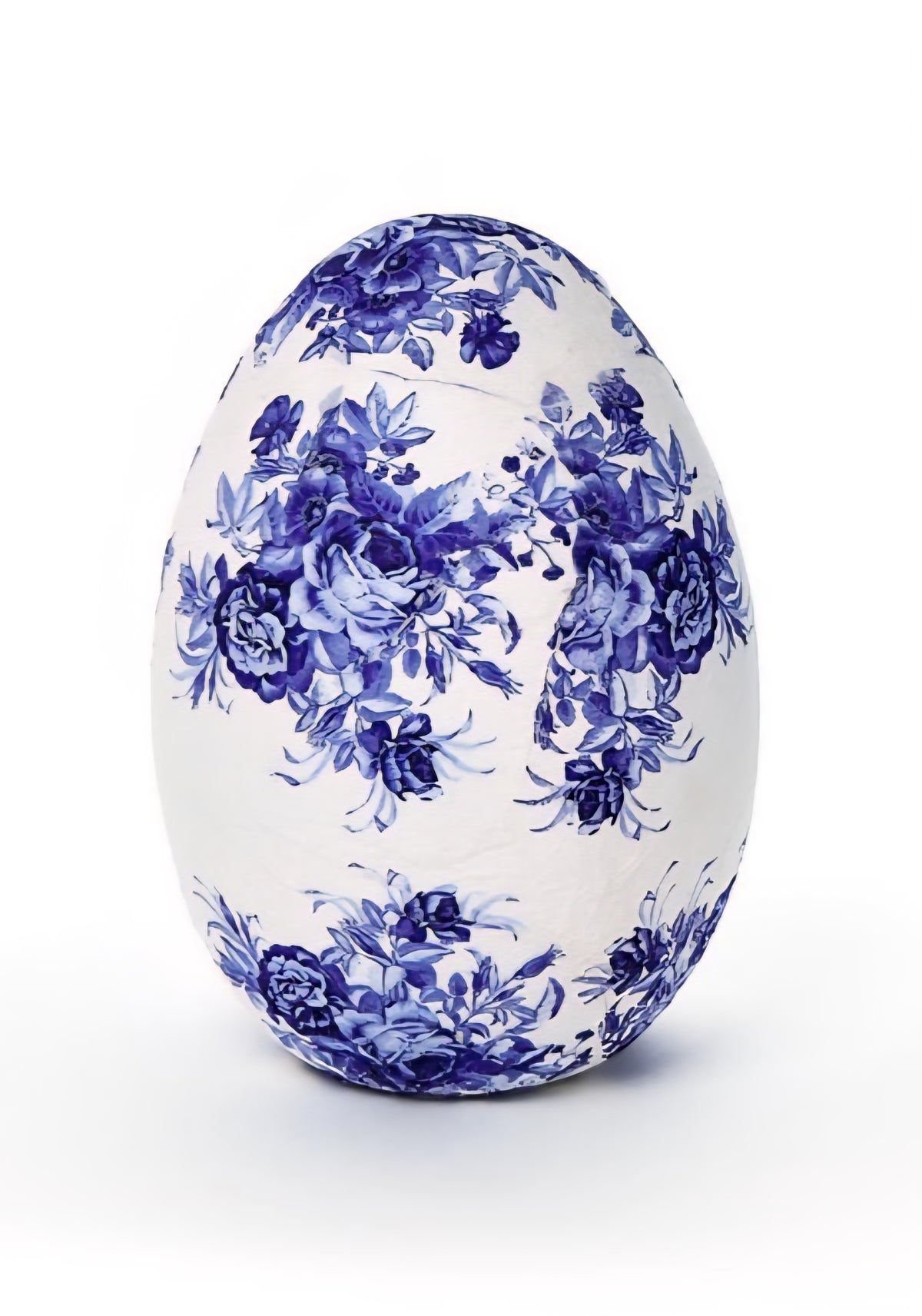Decorative egg with blue floral pattern on a white background
