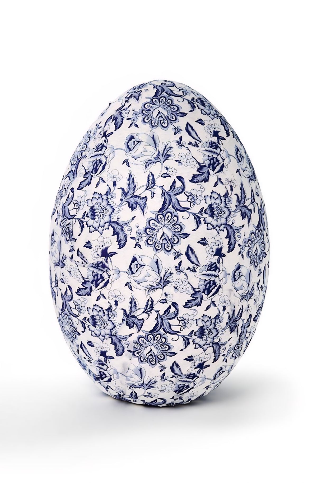 Decorative egg with blue floral pattern on a white background