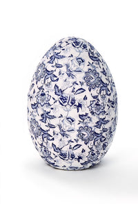 Decorative egg with blue floral pattern on a white background