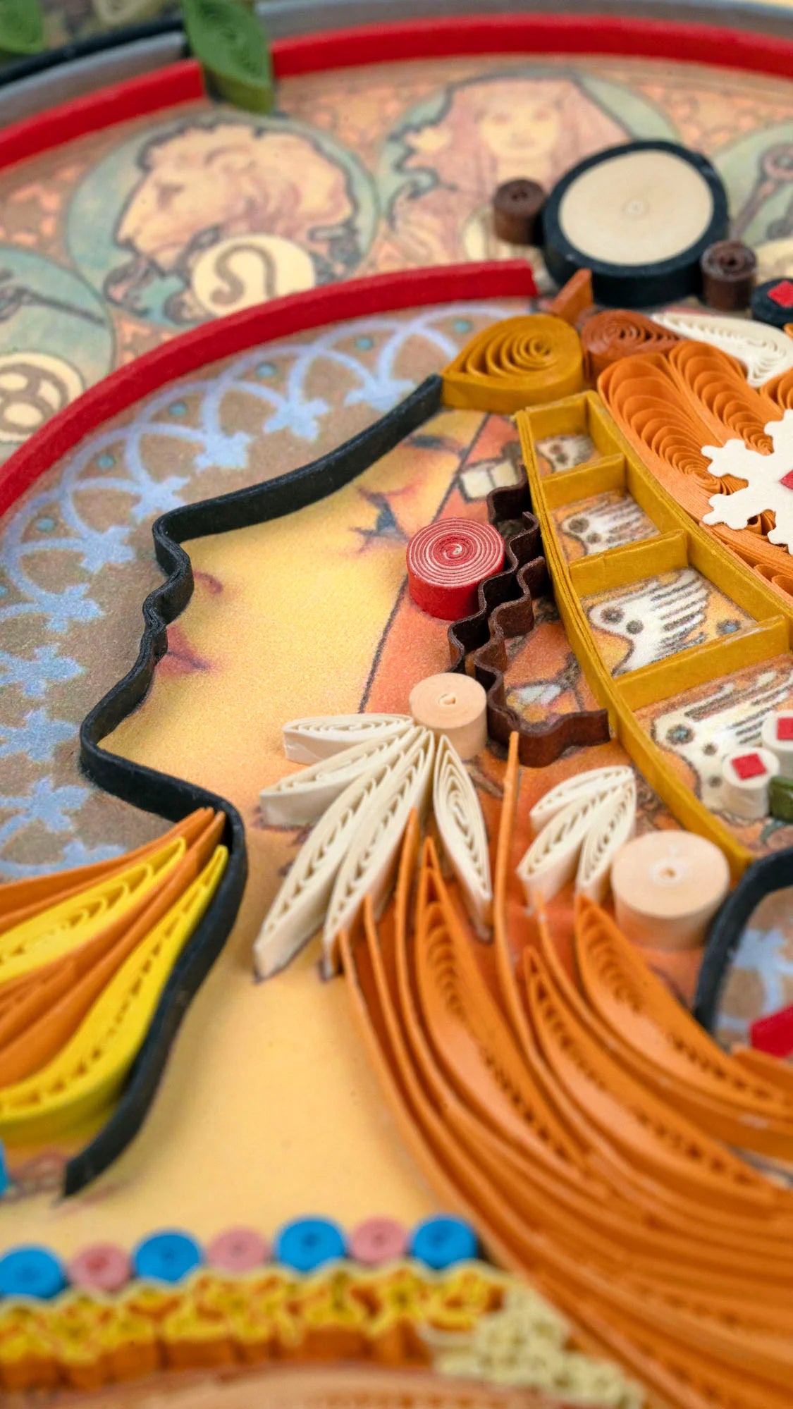 Closeup of quilled greeting card featuring Alphonse Mucha's 1896 lithograph 'Zodiac'