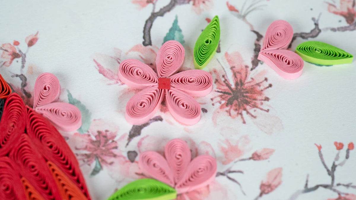 Quilled flowers and leaves on a floral background