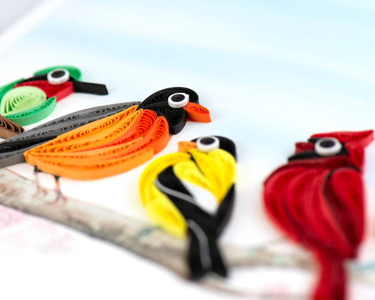 Colorful quilled birds on a greeting card on a white background