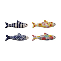 Four decorative fish figurines with different patterns on a white background