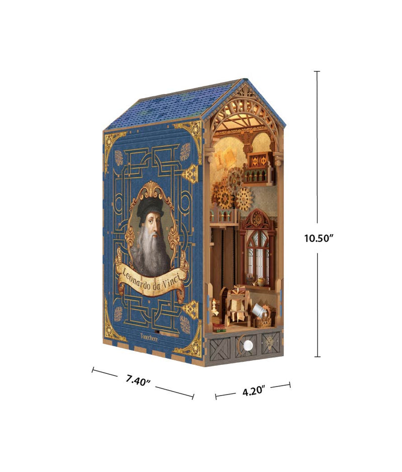 A decorative wooden house-shaped box with a blue front panel featuring a portrait and gold ornamental detailing, shown with dimension lines indicating 10.50 inches tall, 7.