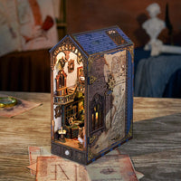A wooden miniature book nook of Leonardo da Vinci's workspace.