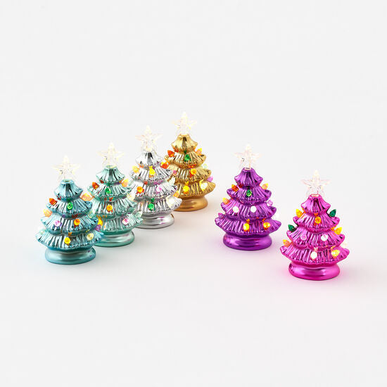 A set of six light-up colored glass Christmas trees, each with a different color with star and mini light bulb decorations.