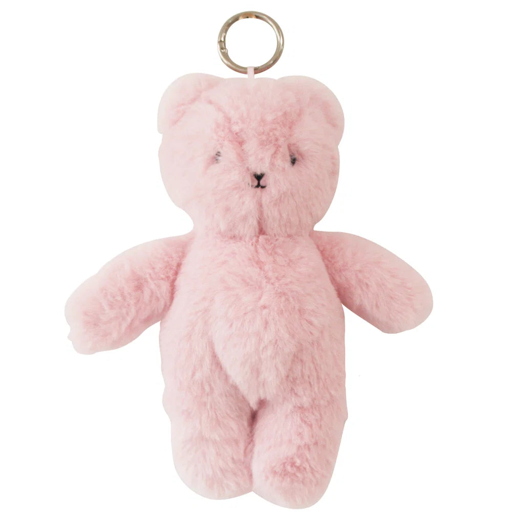 Pink teddy bear keychain on a white background