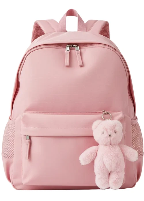 A light pink nylon backpack with a front zippered pocket, mesh side pockets, and a small plush teddy bear keychain attached to the front.