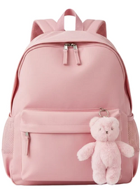A light pink nylon backpack with a front zippered pocket, mesh side pockets, and a small plush teddy bear keychain attached to the front.
