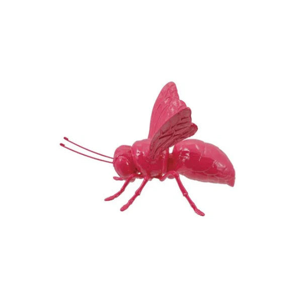 Pink bee-shaped object on a white background