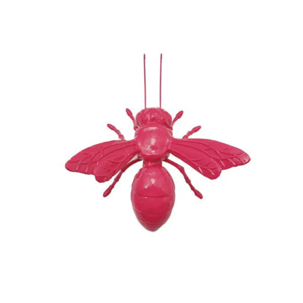 Pink bee-shaped object on a white background