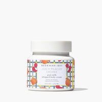 Jar of Beekman 1802 Juicy Peachy Lychee whipped body cream on a white background