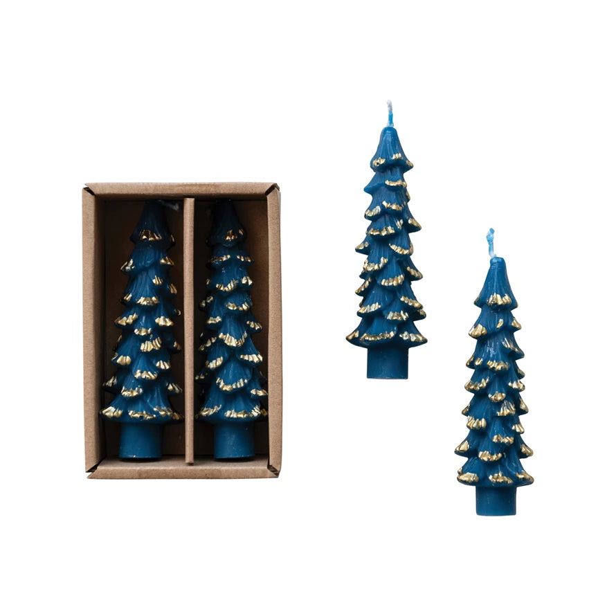 Set of blue candle trees with gold accents, one in a box and two on a white background.