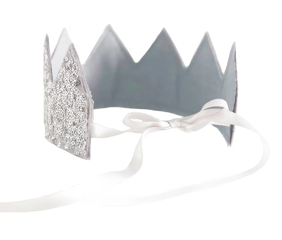 A silver glitter and metallic crown headband with white ribbon ties, shown on a plain white background.