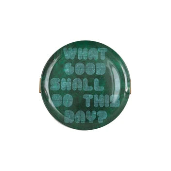 Green plate with text 'What good shall do this day?' on a white background