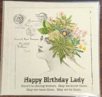Greeting card with a woman's profile and floral design, featuring text about strong women.