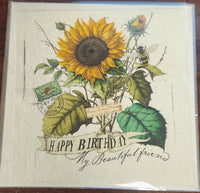 Vintage-style birthday card with sunflower, bee, and text on a wooden surface
