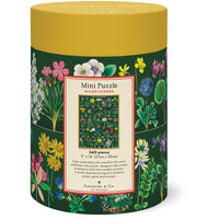 Cylindrical puzzle box with floral design and yellow lid