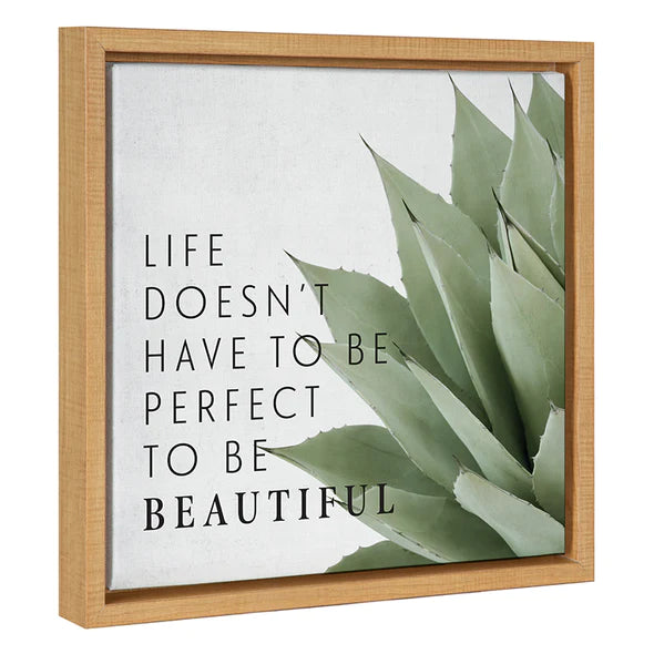 A framed canvas wall art with a green aloe vera plant and the text 'Life doesn't have to be perfect to be beautiful' written in black.